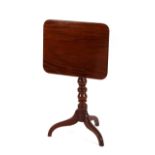 A 19th Century mahogany oblong snap top occasional table, raised on a turned baluster column and