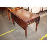 A William IV mahogany drop leaf dining table, fitted single end drawer and opposing dummy drawer