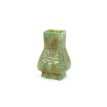 A jade baluster vase, decorated with stylised motifs, 21cm high