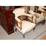 A pair of Edwardian inlaid tub shaped chairs, raised on turned tapering front supports terminating