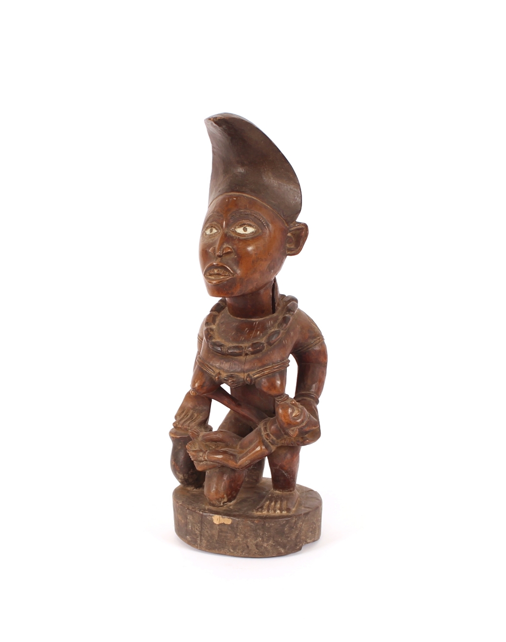 A well carved West African wood fertility figure, having glass eyes, 44cm high