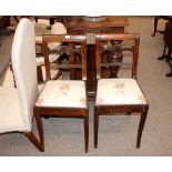 A pair of 19th Century inlaid side chairs, the top rails with trailing marquetry decoration, foliate