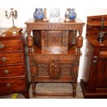 A miniature Ipswich oak court cupboard, having carved decoration, wedge shaped upper cupboard