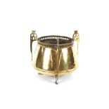 A brass Arts & Crafts design three handled planter, 18cm high, 22cm dia. overall