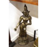 A large Oriental brass figure, depicting a deity, 90cm high