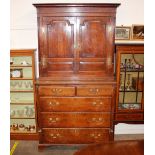 A George III oak mahogany cross-banded and inlaid cabinet on chest, the upper section fitted shelves