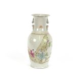 A Chinese baluster vase, decorated with lines of calligraphy, flanked by kylin handles, having