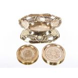 An oval silver bon bon dish, London 1928; and two Persian white metal pin dishes, marked(3)