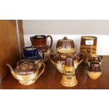 A collection of various Doulton Harvest ware items, to include tobacco jar, jugs, teapot etc. (9)
