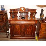 A Victorian mahogany chiffonier, with raised back, blind frieze drawer and cupboards below on