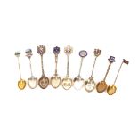 Nine silver hallmarked and enamel topped souvenir spoons