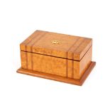 A burr walnut trinket box, with coronet decoration to the top, stamped M & P; an amber coloured