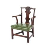 A late 18th/early 19th Century carved mahogany elbow chair, in the Chippendale  manner, the vase