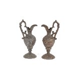 A pair of decorative copper and spelter baluster ewers, 25cm high