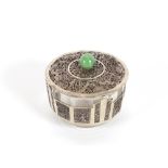 An Oriental glass and white metal mounted powder bowl and cover, with green hardstone terminal,