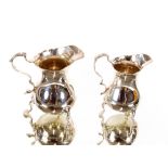 A small Victorian silver baluster cream jug, Chester 1898; and a smaller similar, marks indistinct