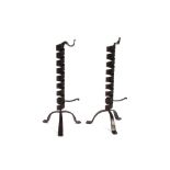 A pair of wrought iron "PigTail" candlesticks, in the 18th Century taste, with spiral stems,