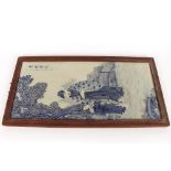 A Chinese blue and white porcelain plaque, depicting figures in a garden, 91cm x 37cm