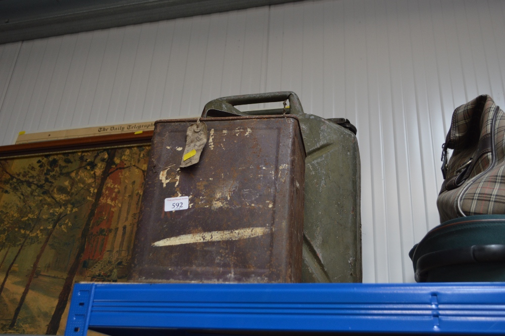 A jerry can; together a vintage Esso can