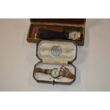 A ladies 9ct gold cased wrist watch; and a gents