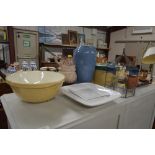 A mixing bowl; a large blue glazed jug and various