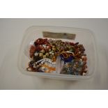 A box containing coral beads, agate, and assorted