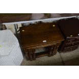 A nest of three oak occasional tables