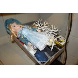 A tray containing a dressed doll; small barometer