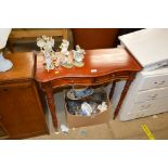 A hardwood serpentine hall table fitted two drawer