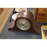 An oak cased three hole mantel clock