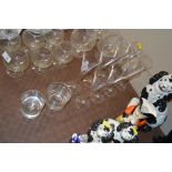 A set of eight glass Champagne flutes; and two gla