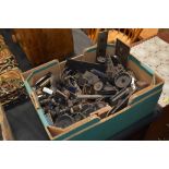 A box of old radio knobs, switches and sundries
