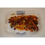 A tray of amber coloured beads