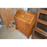 A reproduction yew wood bureau fitted four long dr