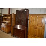 A George III mahogany bureau bookcase, the glass