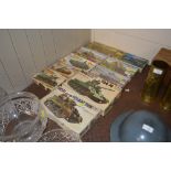 A collection of various model military vehicles to