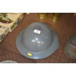 A WW2 style tin helmet