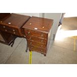 A reproduction mahogany chest fitted four drawers