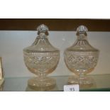 A pair of cut glass bon bon dishes and covers