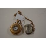 A gold plated half hunter pocket watch, attached w