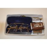 A box of old spectacles; and a white metal mounted