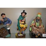 A Royal Doulton figure "The Mask Seller" HN2103