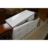 Two white painted chests of drawers and matching d