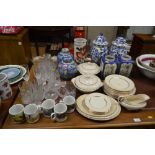 A pair of large blue and white vases and covers; a