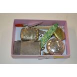 A box containing a silver plated Vesta case, a whi