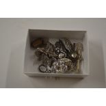 A box of assorted silver brooches, pendants etc.