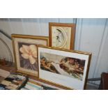 A pair of gilt framed floral prints; together with