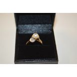 A yellow metal pearl and diamond set ring; and a 9