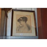 A framed and glazed pencil sketch of a lady