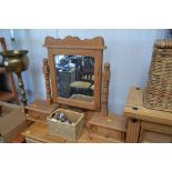 A dressing table mirror fitted two drawers